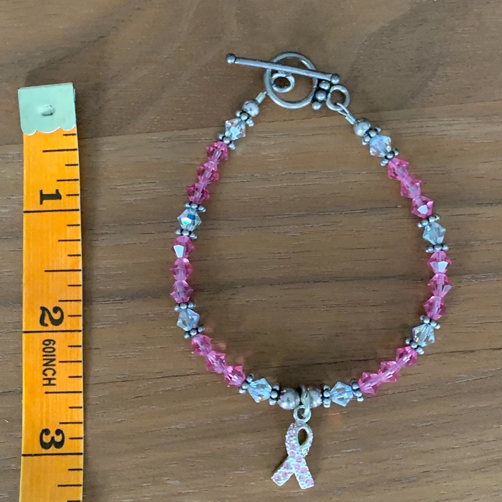 Pink & Clear Beaded Bracelet with Crystal Ribbon Charm & sterling accents.
